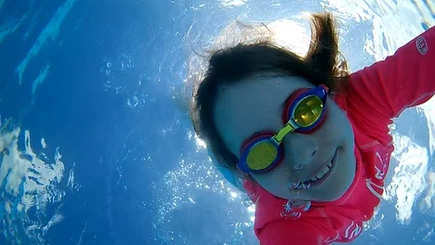 Family in pool Stock Footage 107824248