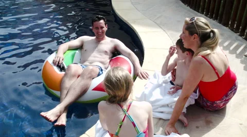 Family at poolside. Stock Footage 64109733