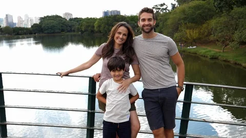 Family posing by lake Stock Footage 89354974