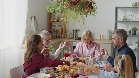 Family Praying on Easter Dinner at Home Stock Footage 224555877