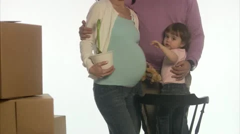 A family with a pregnant mother about to move Stock Footage