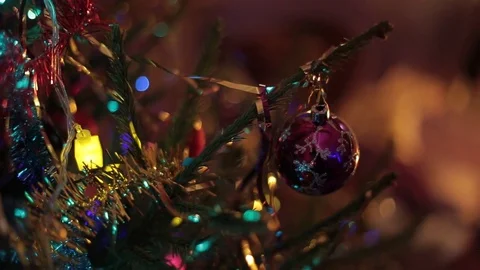 A family presents their presents while sitting under a christmas tree. Stock Footage 76255693
