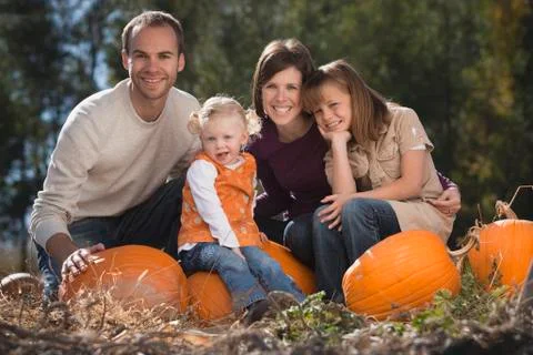 Family in pumpkin patch Fotos de archivo
