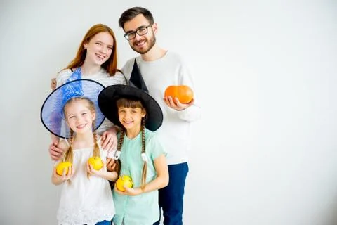 Family with pumpkins Stock Photos