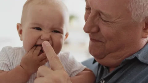 Family Relation of Elder 60s Man and Happy Baby Girl. Casual Life and Wrinkled S Stock Footage 199479073