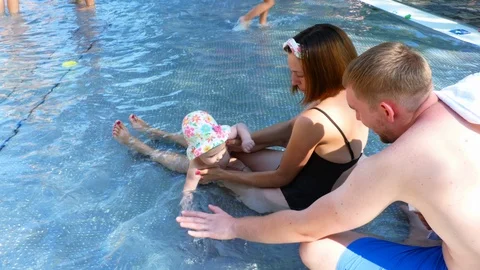 Family is resting in the pool Stock Footage 95197959