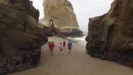 Family Running On Beach Stock Footage