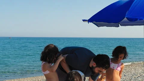 A Family Setting Up A Spot At The Beach Stock Footage 280254534