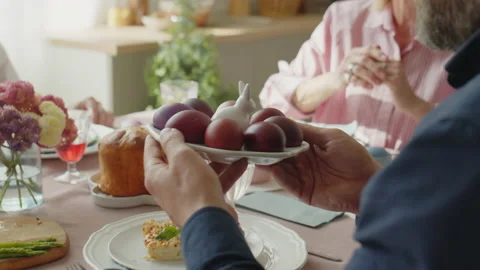 Family Sharing Easter Eggs on Festive Dinner Stock Footage 224558565