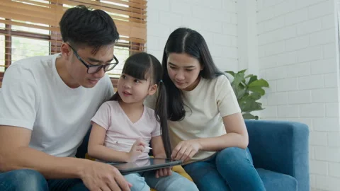 Family sitting and using computer laptop technology. 스톡 동영상 160060181