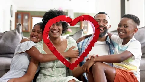 Family sitting sofa while sketch heart appearing over family, filling 3D ring, Stock Footage 340674695