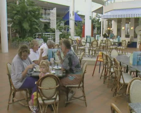 Family sitting at table eating Stock Footage