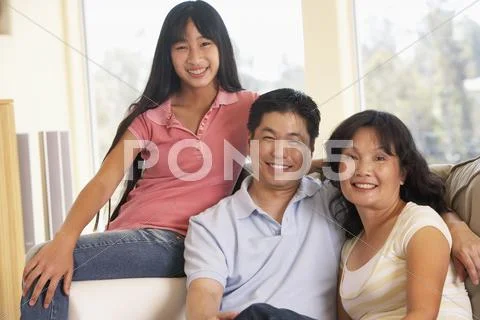Family Sitting Together At Home Stock Photos