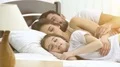 The family sleeping on the bed 4k or 4k+ Resolution