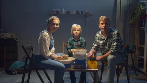 The family spends time together in the workshop Stock Footage 128182027