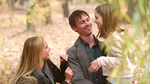 Family standing in park and talking, father carries daughter in his arms Stock Footage 59554436