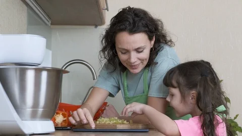 Family with a tablet in the kitchen. Stock Footage 115537791
