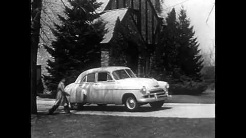 A family takes a drive in a Chevrolet automobile and they travel down an Stock Footage
