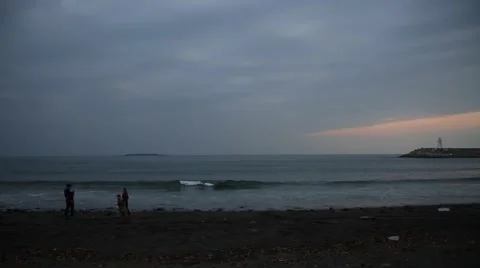 Family taking photos with smart phone on beautiful sand beach at sunset Stock Footage 59131790