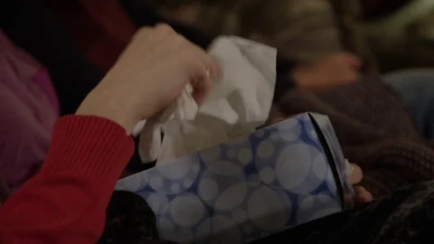 Family taking tissues from tissue box Stock Footage 69887701