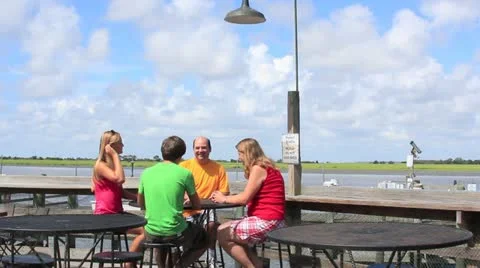 Family talking at table Stock Footage 11427304