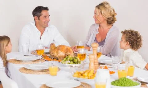 Family talking together before to eat Stock Photos
