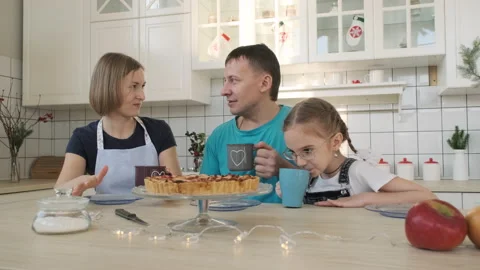 Family of Three Chatting while Having Breakfast Stock Footage 168174232