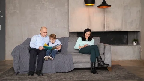 Family of three on the couch Video stock 89472445