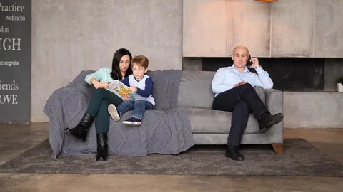 Family of three on the couch Video stock 89472587
