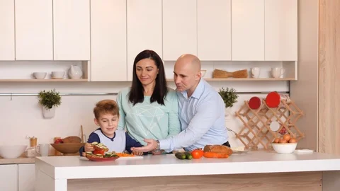 Family of three in the kitchen Stock Footage 89320480