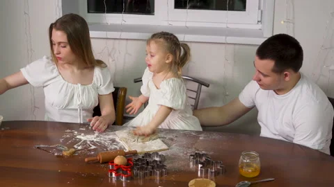 A family of three preparing baking dough Stock Footage 228463638