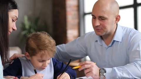 Family of three at the table Video stock 89216403