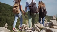 Family Of Travelers Walks In The Mountains. Young Woman Leads Her Children On A Stock Footage