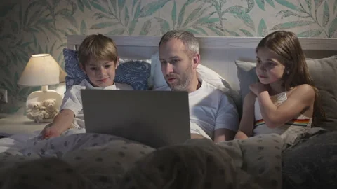 Family using laptop in bed. Stock Footage 162662055