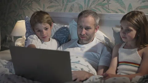 Family using laptop in bed. Stock Footage 162766092