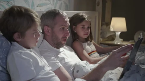 Family using laptop in bed. Stock Footage 163235337