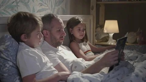 Family using laptop in bed. Stock Footage 164725879