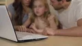 Family using laptop for shopping, booking tickets online or viewing pictures 4k or 4k+ Resolution