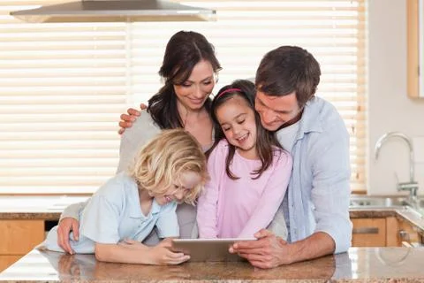 Family using a tablet computer together Foto stock