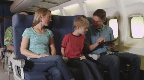 Family using tablet on plane Stock-Footage 67345483