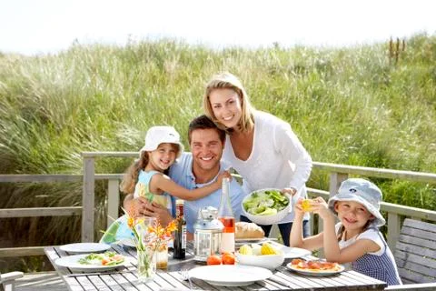 Family on vacation eating outdoors Stock Photos