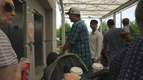 Family waiting for elevator Stock Footage 90362274