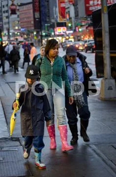 Family Waking after the rains in NYC Stock Photos