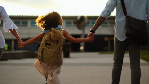 Family walking at airport Stock Footage
