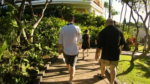 Family Walking Down A Path Together At A Beach Resort Video stock 120615807