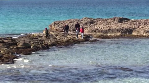 Family Walking On Rocks At The Beach Stock Footage 71972453