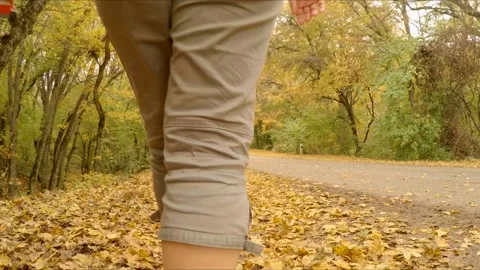 Family walking by the side of the road Stock Footage 120423913