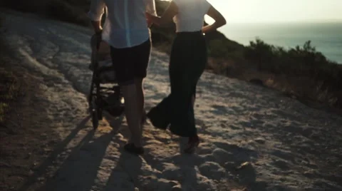 Family walking with stroller Stock Footage 63074562
