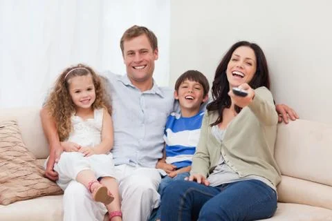 Family watching comedy together Stock Photos