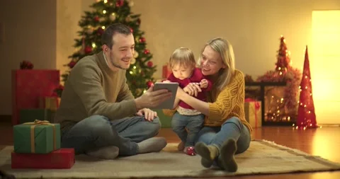 Family waving to tablet during christmas Stock Footage